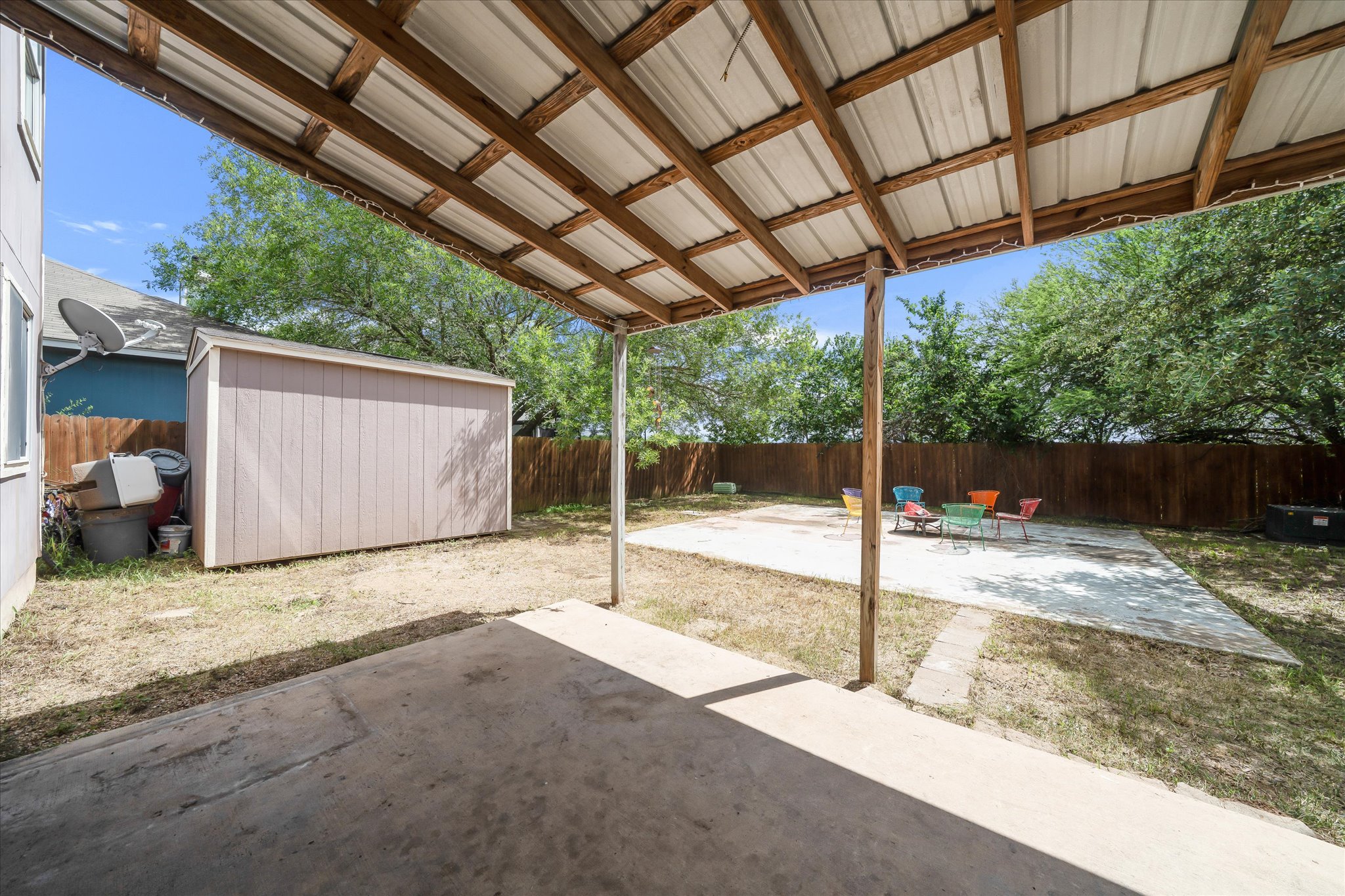 2601 Highcloud Drive Lockhart, TX 78644 - Photo 28 of 30 a backyard of a house with a tree and wooden fence