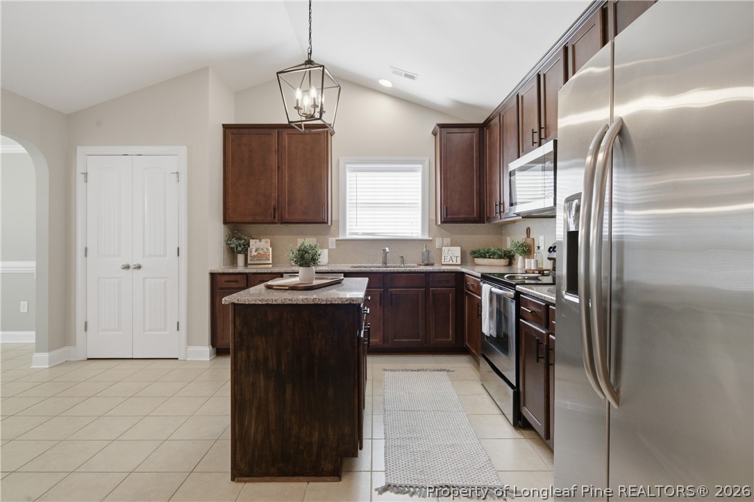 415 Colonist Place Cameron, NC 28326 - Photo 11 of 49 a kitchen with a refrigerator sink and stove