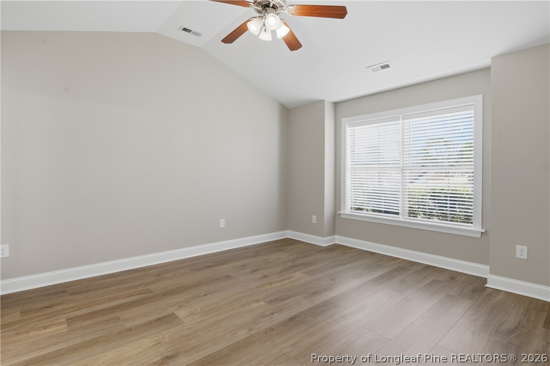 415 Colonist Place Cameron, NC 28326 - Photo 19 of 49 a view of an empty room with wooden floor and a window
