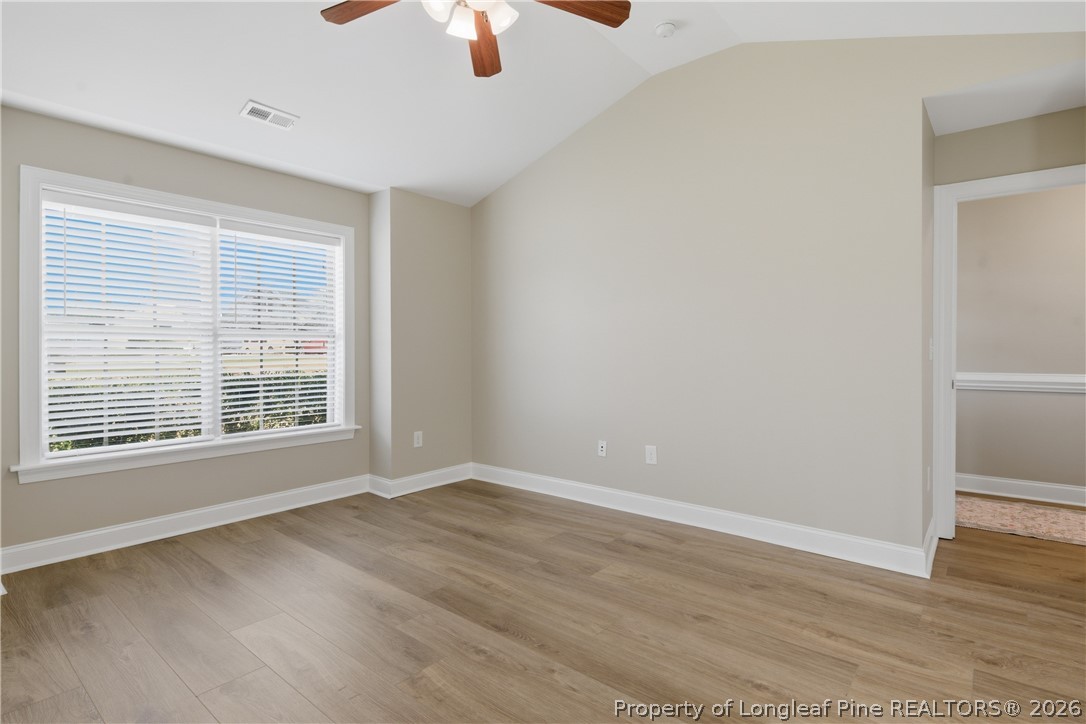 415 Colonist Place Cameron, NC 28326 - Photo 20 of 49 a view of an empty room with wooden floor and a window