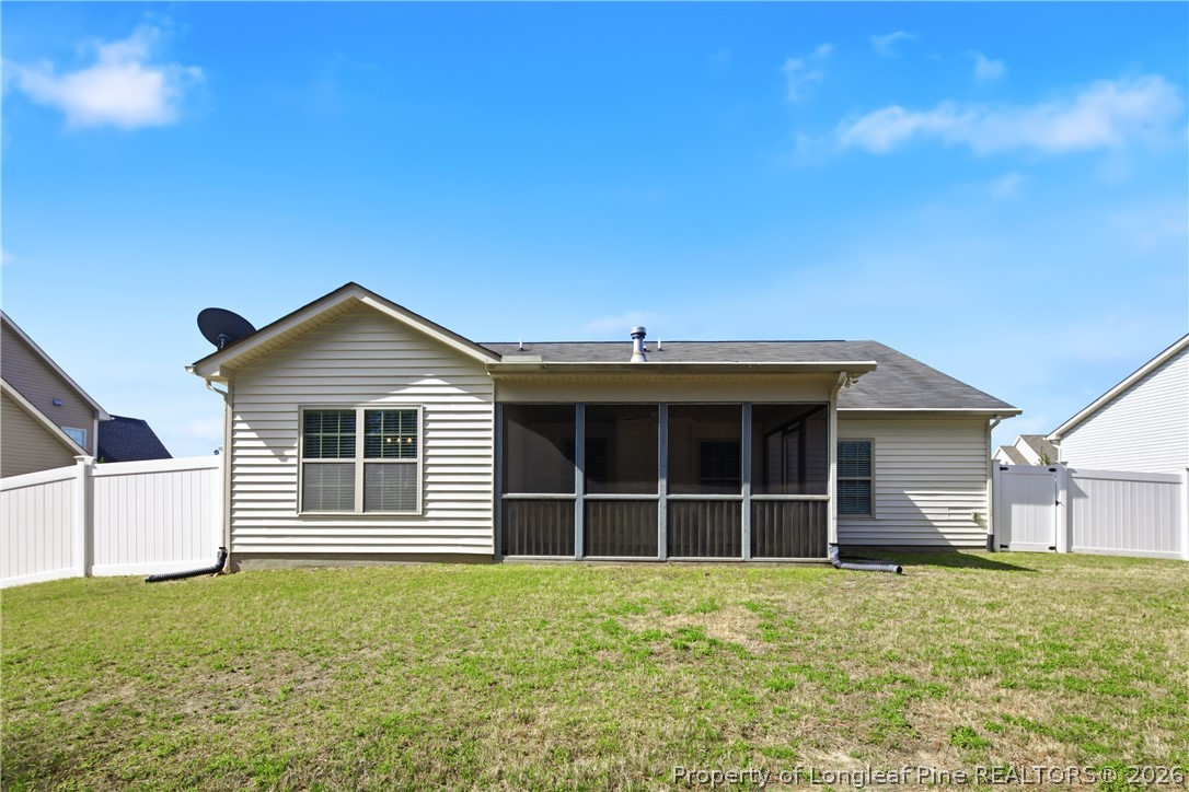 415 Colonist Place Cameron, NC 28326 - Photo 2 of 49 a front view of a house with a garden