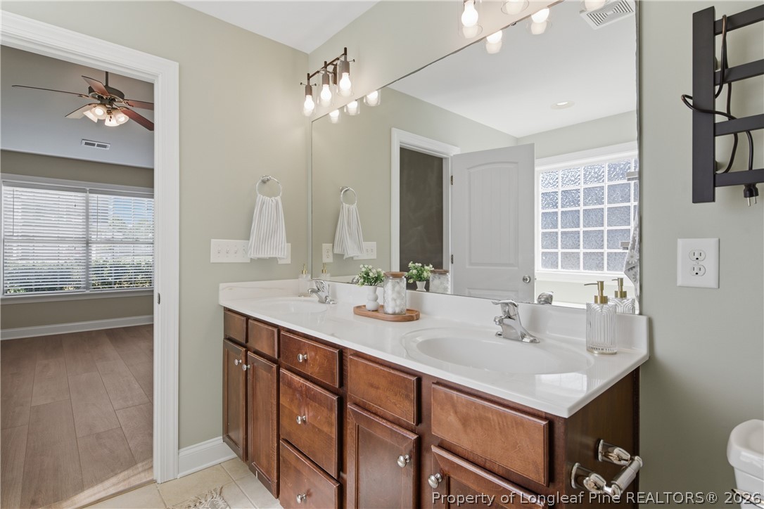 415 Colonist Place Cameron, NC 28326 - Photo 25 of 49 a bathroom with a sink double vanity and a mirror