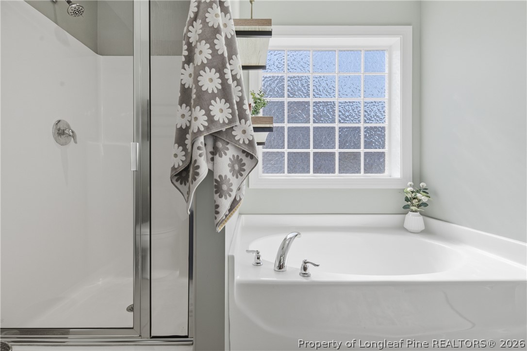 415 Colonist Place Cameron, NC 28326 - Photo 26 of 49 a bathroom with bathtub and shower
