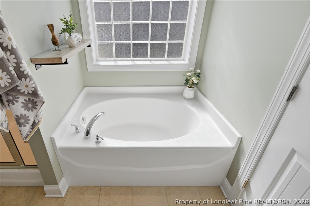 415 Colonist Place Cameron, NC 28326 - Photo 27 of 49 a white bath tub sitting next to a window