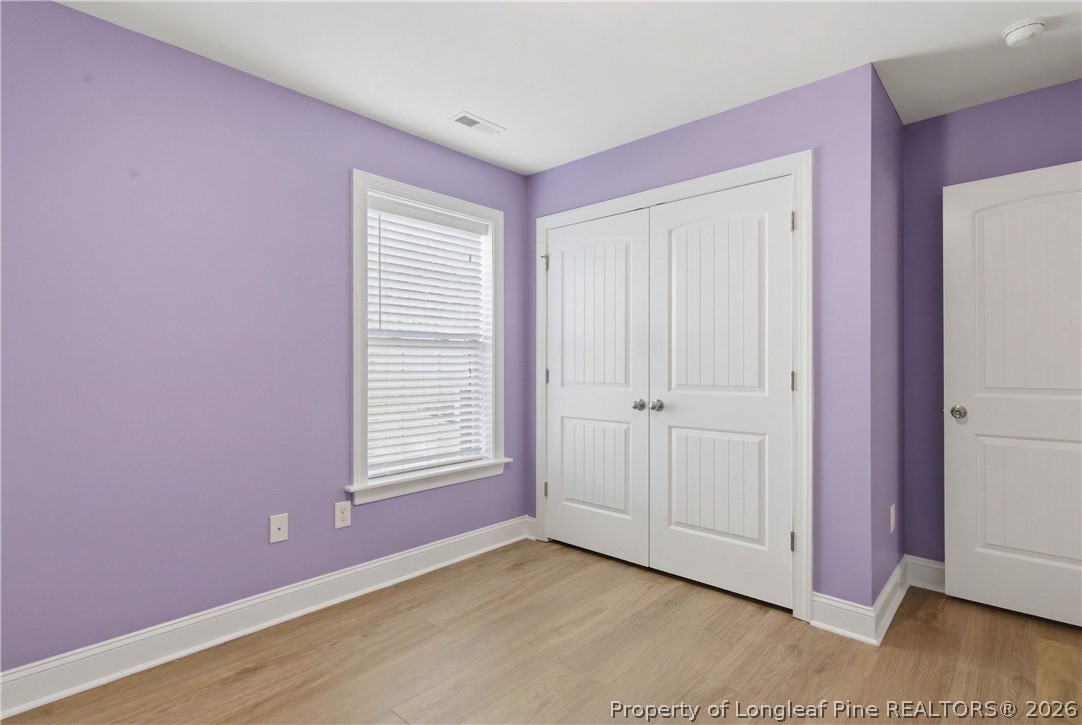 415 Colonist Place Cameron, NC 28326 - Photo 30 of 49 a view of an empty room with wooden floor and a window