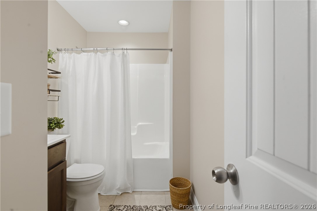415 Colonist Place Cameron, NC 28326 - Photo 33 of 49 a white toilet sitting next to a shower curtain