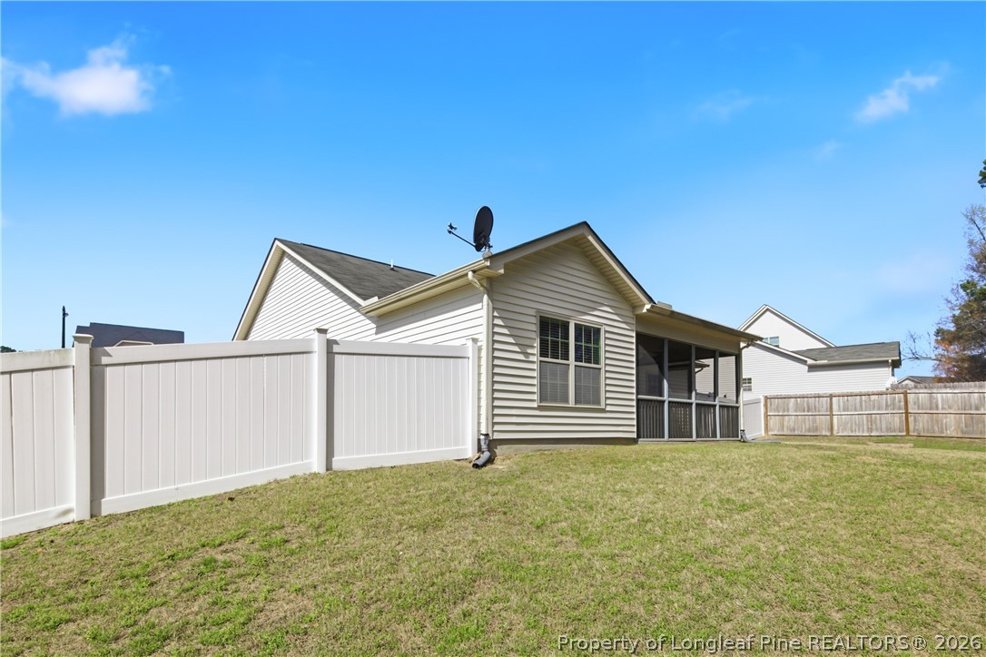 415 Colonist Place Cameron, NC 28326 - Photo 41 of 49 a front view of a house with a yard