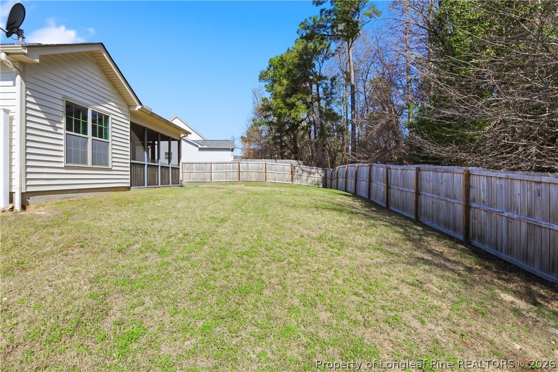 415 Colonist Place Cameron, NC 28326 - Photo 42 of 49 a view of a backyard with wooden fence