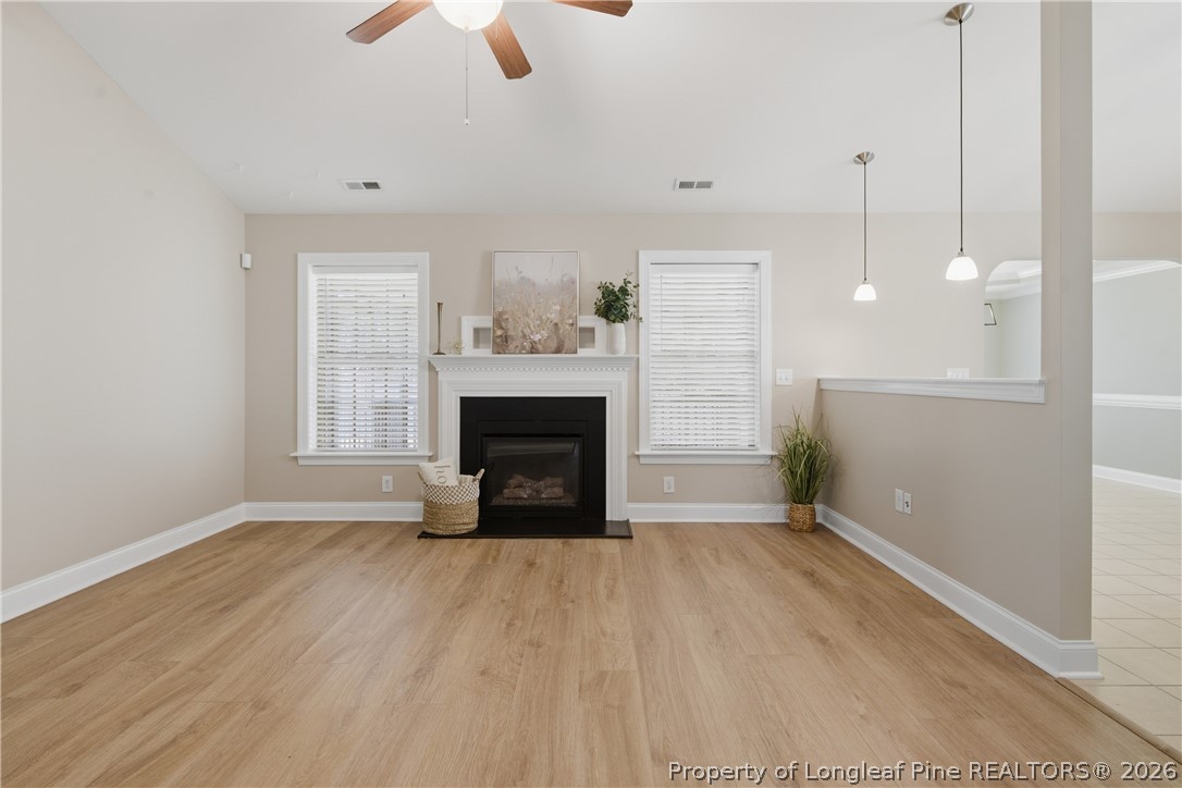 415 Colonist Place Cameron, NC 28326 - Photo 6 of 49 a view of empty room with wooden floor and fan