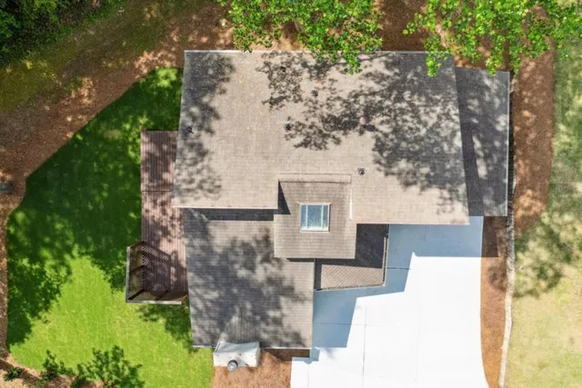 an aerial view of a house with yard swimming pool and outdoor seating