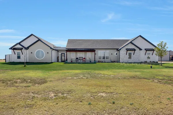 a view of a house with a big yard