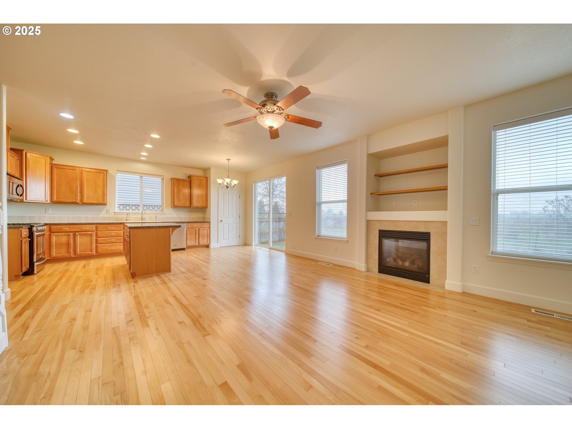 52036 Southeast Icenogle Loop Scappoose, OR 97056 - Photo 16 of 41 a living room with stainless steel appliances furniture and a kitchen view