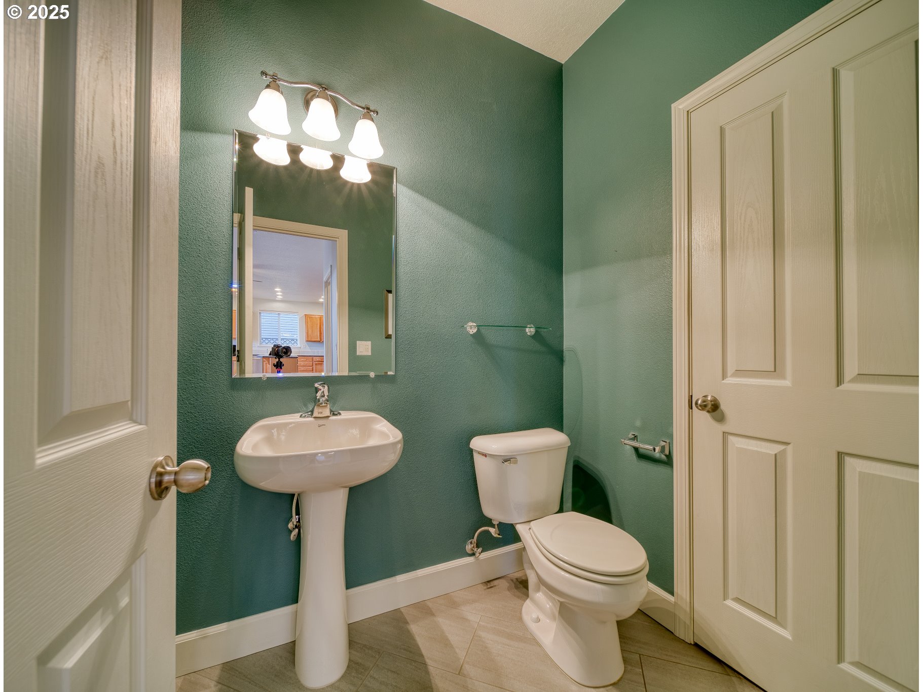 52036 Southeast Icenogle Loop Scappoose, OR 97056 - Photo 21 of 41 a bathroom with a toilet sink and mirror