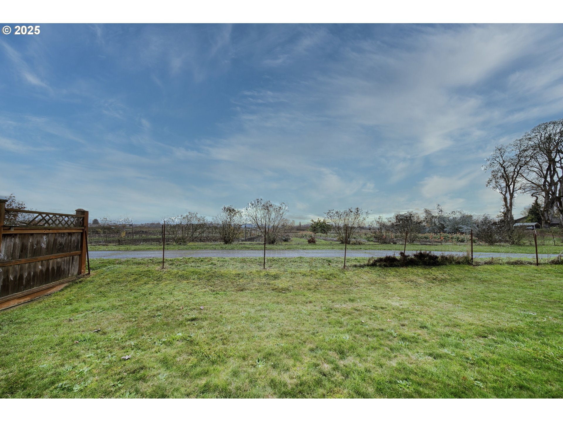 52036 Southeast Icenogle Loop Scappoose, OR 97056 - Photo 38 of 41 a view of a lake with houses in the background
