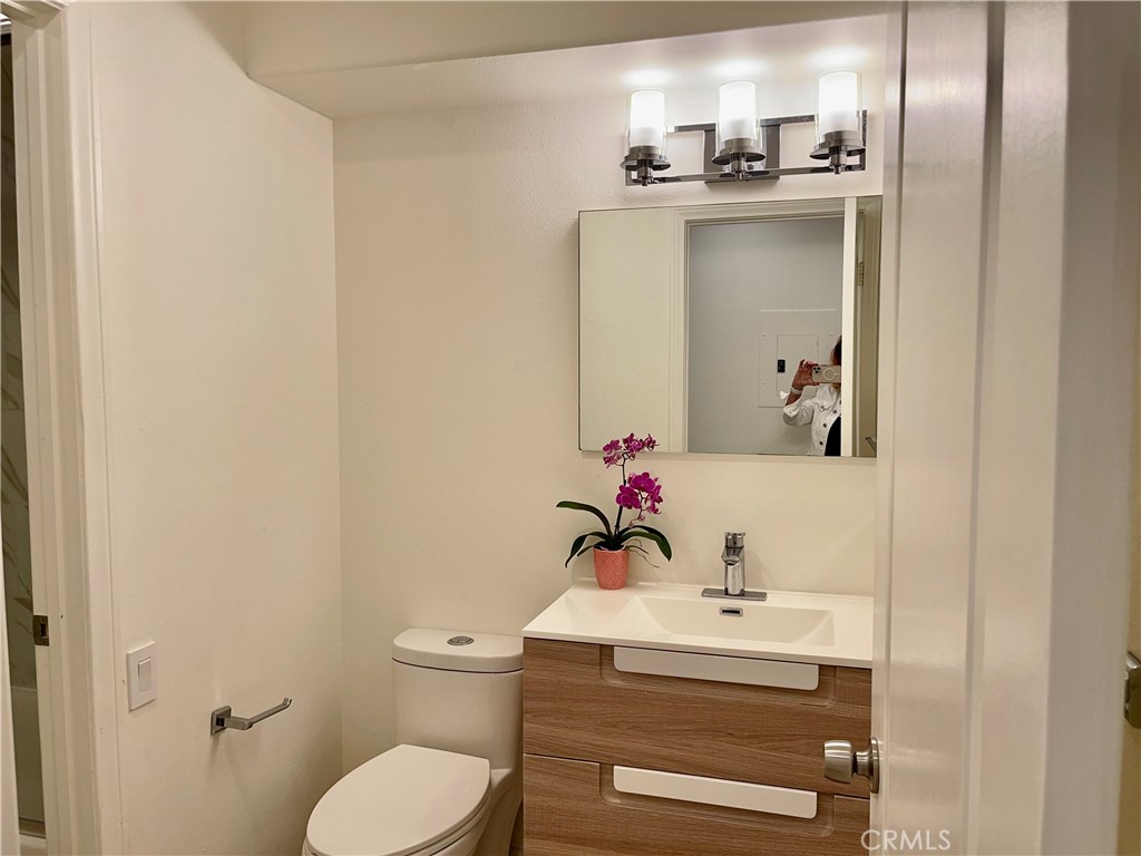 352 Y Place, Unit B Laguna Beach, CA 92651 - Photo 11 of 20 a bathroom with a sink toilet and mirror