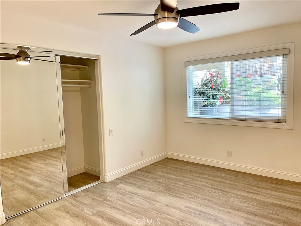 352 Y Place, Unit B Laguna Beach, CA 92651 - Photo 12 of 20 a view of an empty room with wooden floor and a window