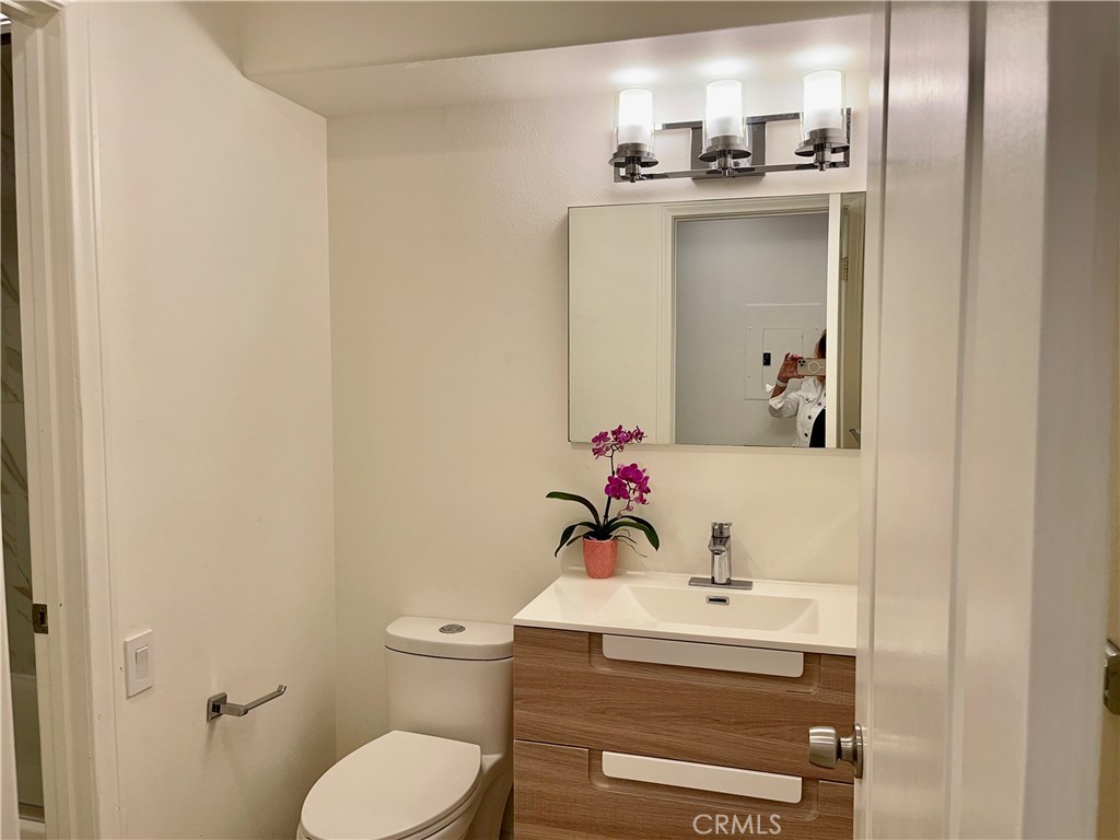 352 Y Place, Unit B Laguna Beach, CA 92651 - Photo 13 of 20 a bathroom with a sink toilet and mirror
