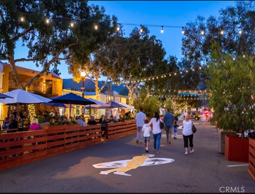 352 Y Place, Unit B Laguna Beach, CA 92651 - Photo 20 of 20 a group of people sitting in a yard in front of a house