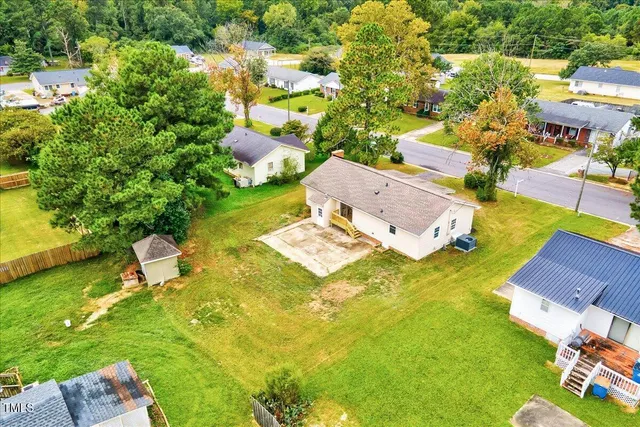 an aerial view of a house with swimming pool