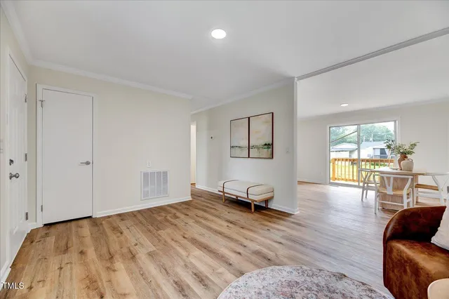 a bedroom with furniture and wooden floor