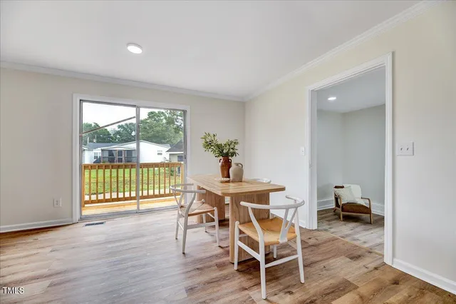 a bedroom with furniture and a wooden floor