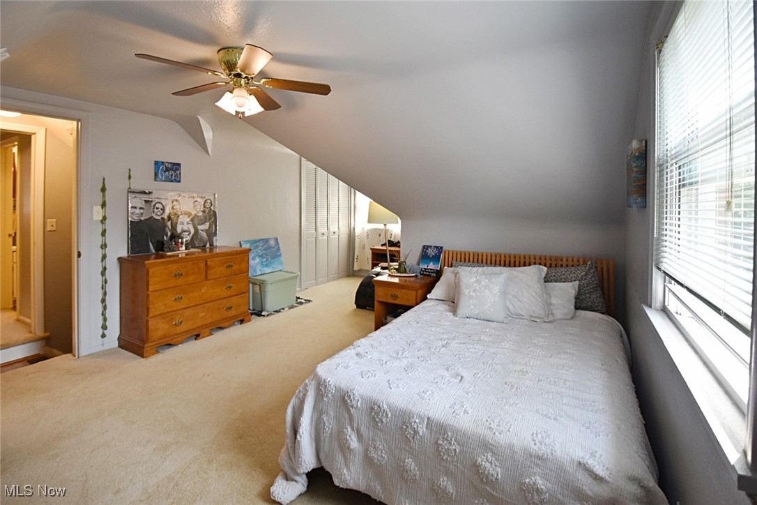 1388 Ford Road Lyndhurst, OH 44124 - Photo 25 of 39 Bedroom featuring carpet, lofted ceiling, and ceiling fan