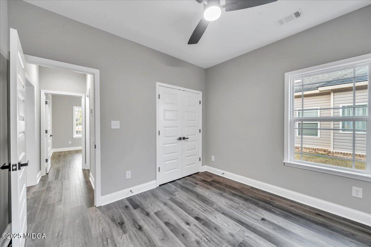 100 Early Drive Byron, GA 31008 - Photo 38 of 49 a view of a room with wooden floor and a window
