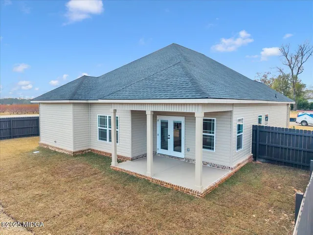 a terrace with a table and chairs