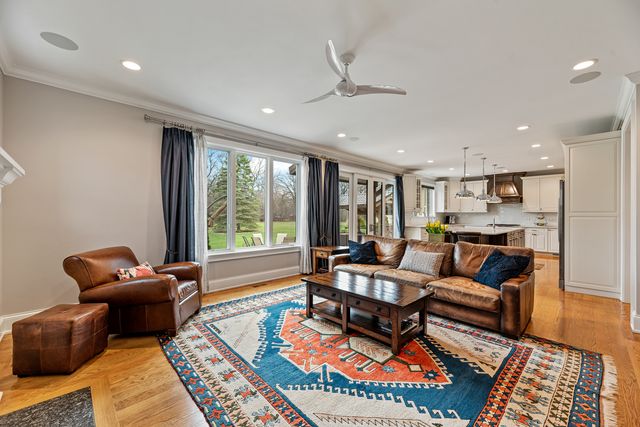 a living room with furniture and a rug