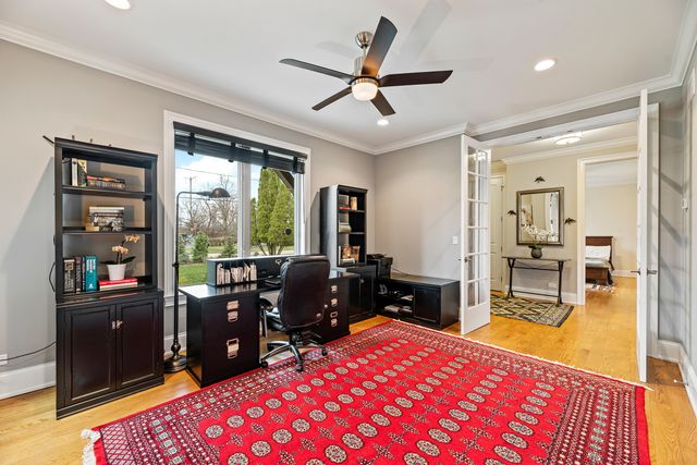 a bed room with a bed and a television