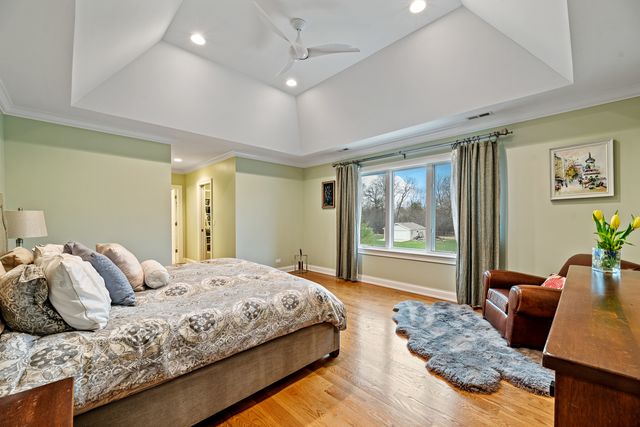 a bedroom with a large bed and a couch