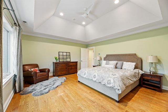 a bedroom with a bed and dresser