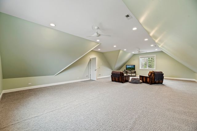 an empty room with furniture and a large window