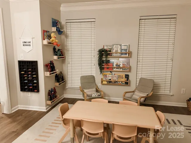 a view of a dining room with furniture and wooden floor