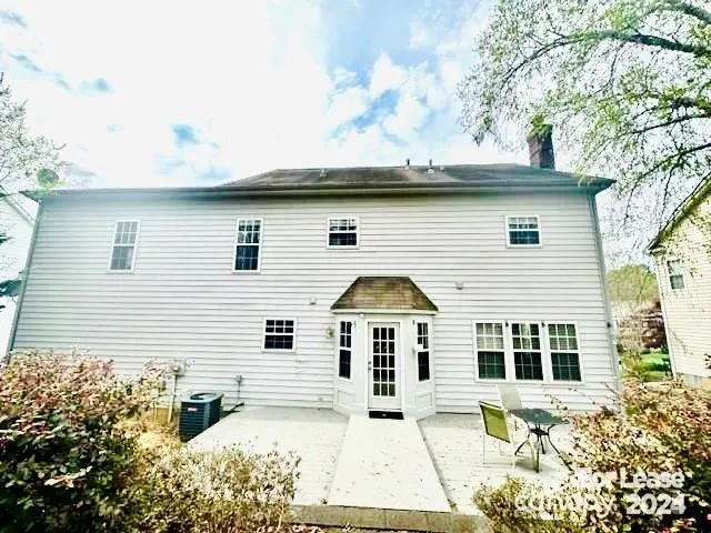 a view of house with yard