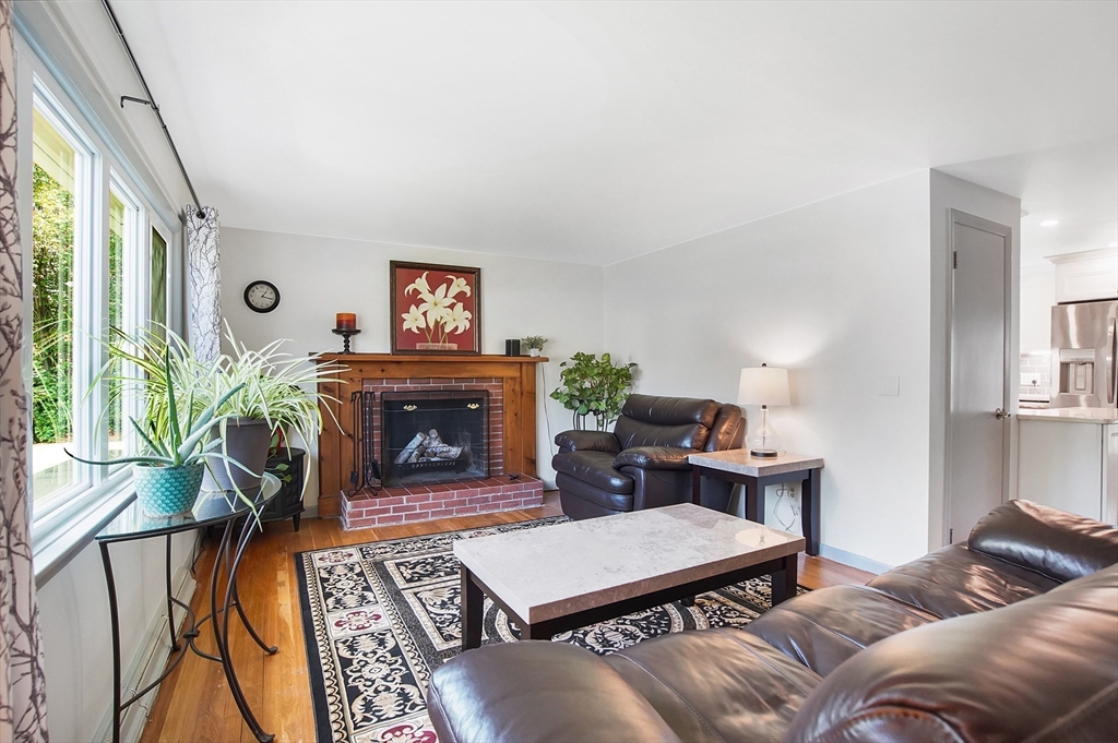 407 Wolf Swamp Road Longmeadow, MA 01106 - Photo 13 of 42 a living room with furniture and a fireplace
