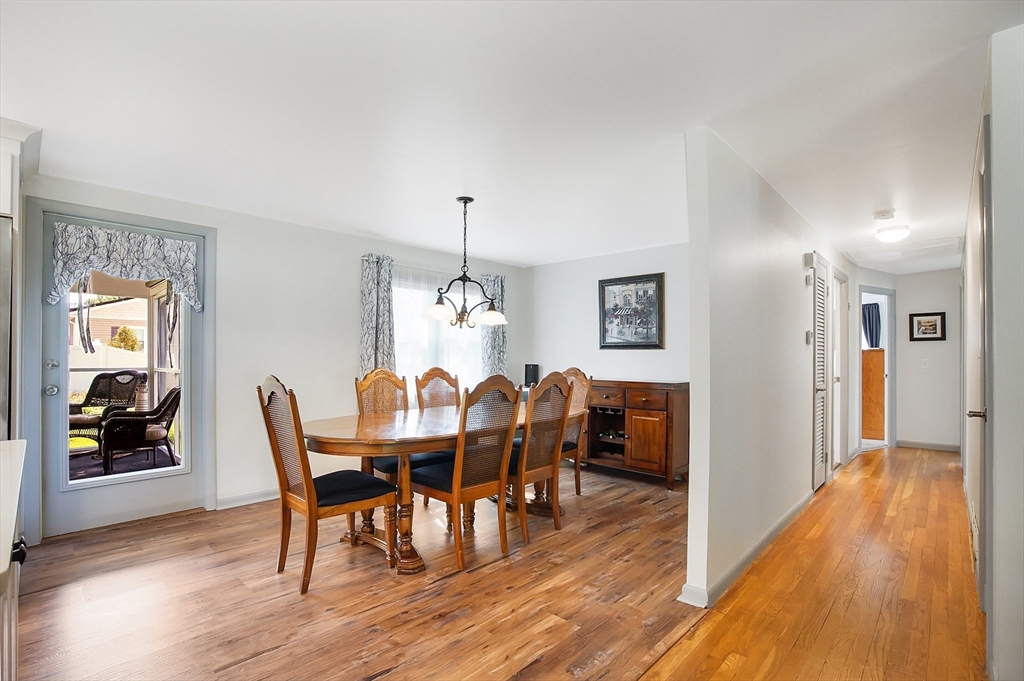 407 Wolf Swamp Road Longmeadow, MA 01106 - Photo 15 of 42 a view of a dining room with furniture and wooden floor