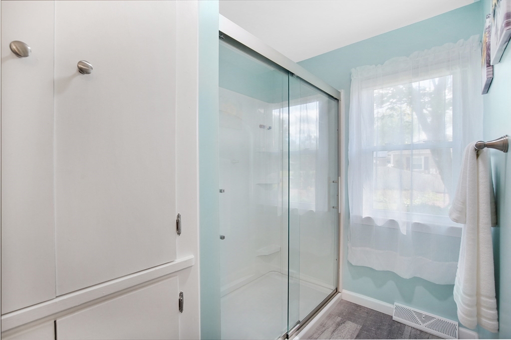 407 Wolf Swamp Road Longmeadow, MA 01106 - Photo 17 of 42 a bathroom with a glass shower door