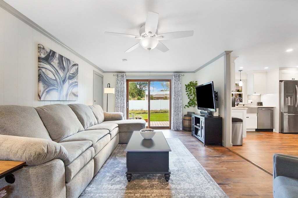 407 Wolf Swamp Road Longmeadow, MA 01106 - Photo 2 of 42 a living room with furniture and a flat screen tv
