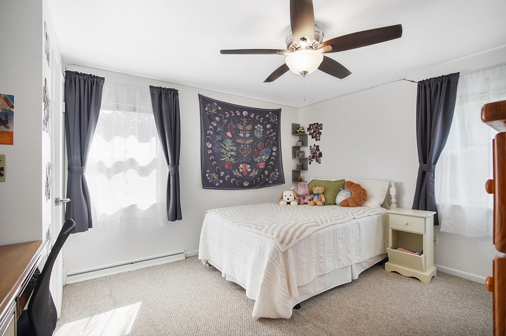 407 Wolf Swamp Road Longmeadow, MA 01106 - Photo 23 of 42 a bedroom with a bed and a large window