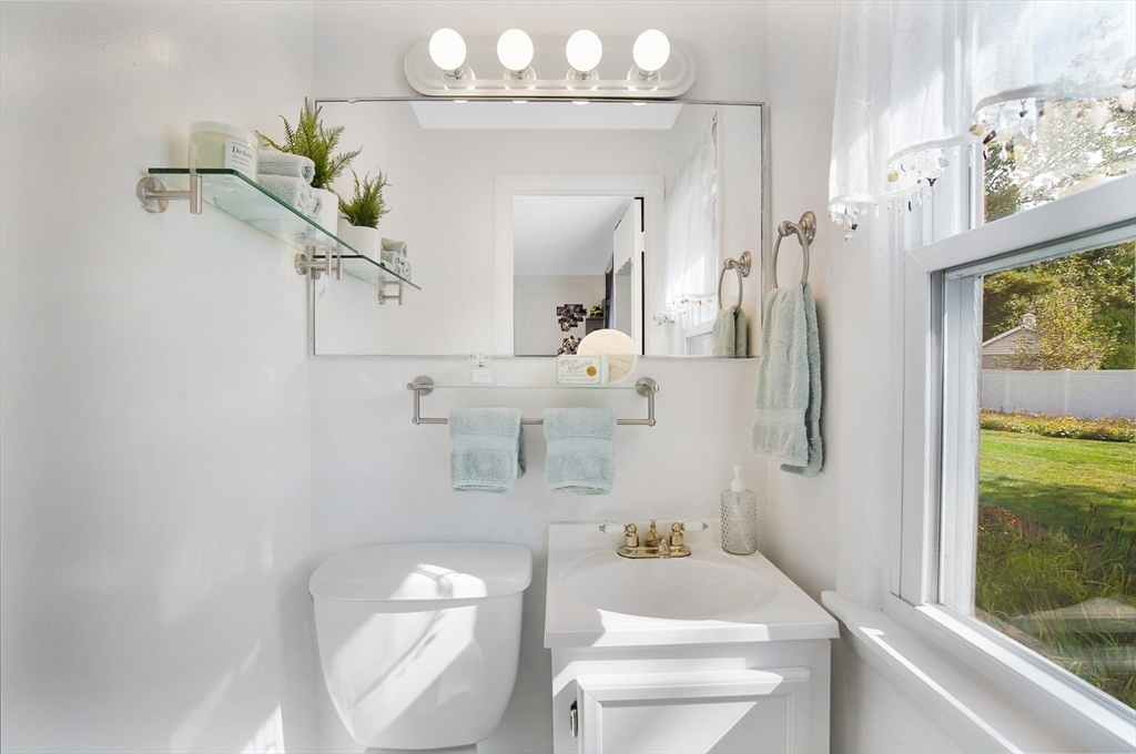 407 Wolf Swamp Road Longmeadow, MA 01106 - Photo 25 of 42 a bathroom with a toilet sink and mirror