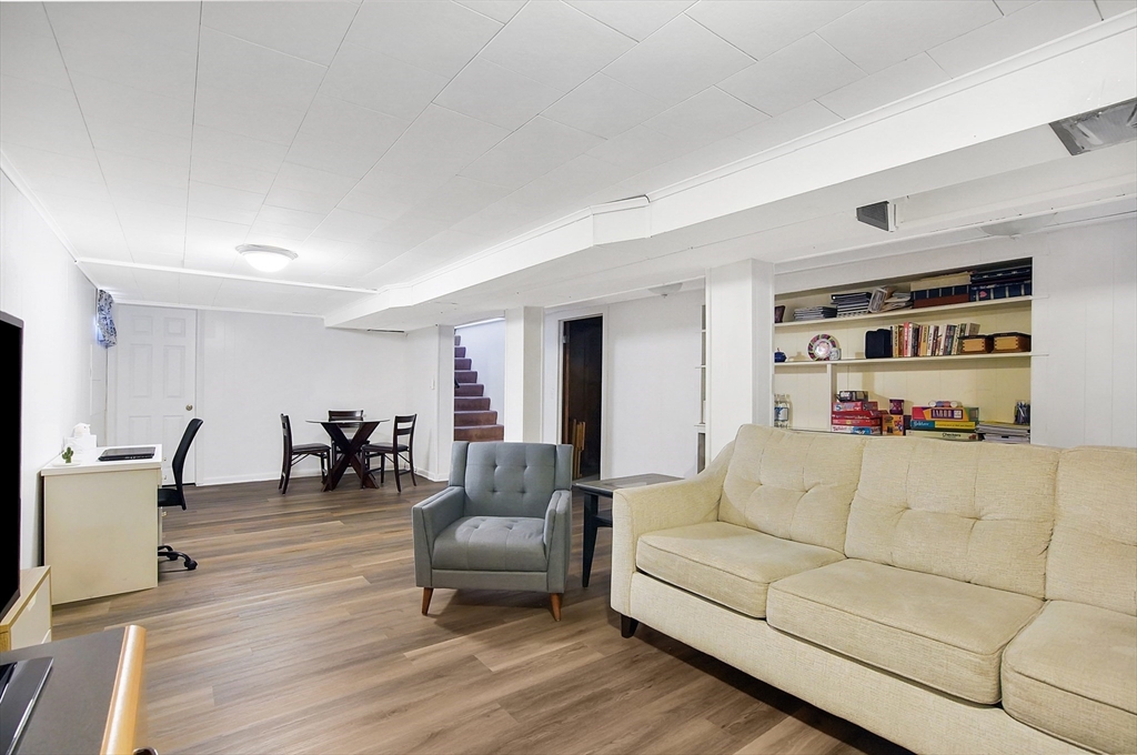 407 Wolf Swamp Road Longmeadow, MA 01106 - Photo 26 of 42 a living room with furniture and a wooden floor