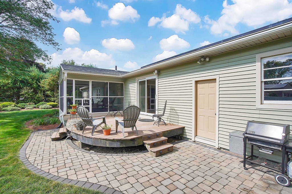 407 Wolf Swamp Road Longmeadow, MA 01106 - Photo 36 of 42 a view of a patio with table and chairs and a yard