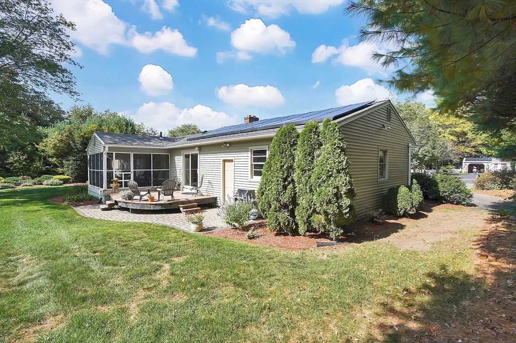 407 Wolf Swamp Road Longmeadow, MA 01106 - Photo 40 of 42 a view of a house with backyard porch and sitting area