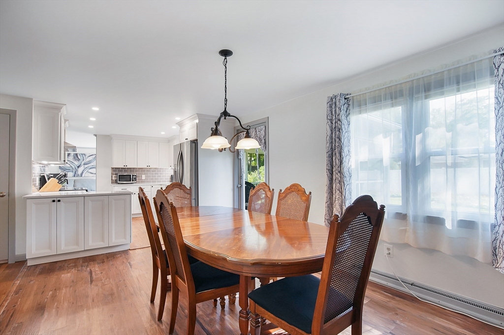 407 Wolf Swamp Road Longmeadow, MA 01106 - Photo 9 of 42 a view of a dining room with furniture window and wooden floor