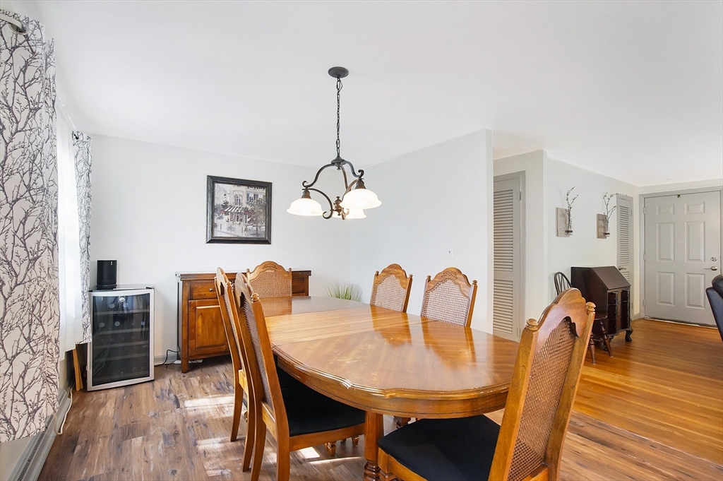 407 Wolf Swamp Road Longmeadow, MA 01106 - Photo 10 of 42 a view of a dining room with furniture wooden floor and chandelier