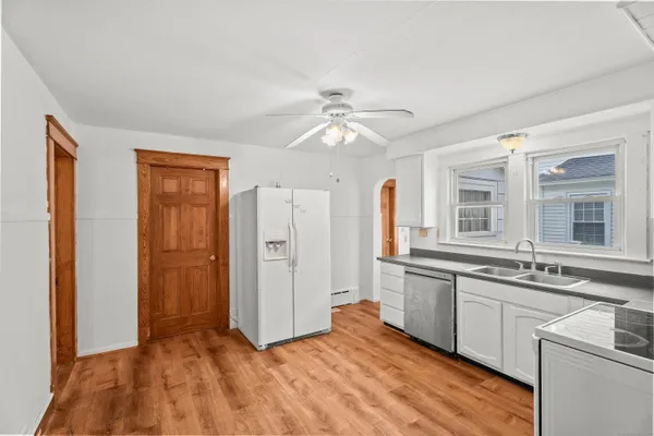 a view of a kitchen with a sink and cabinet area