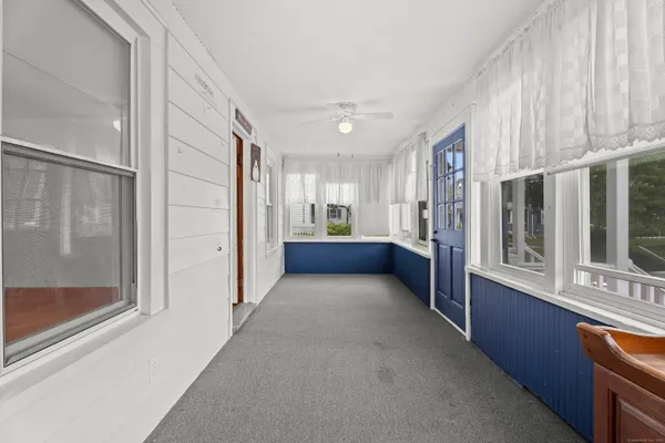 a view of a hallway with windows