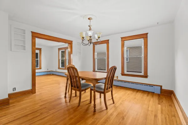 a dining room with furniture and window