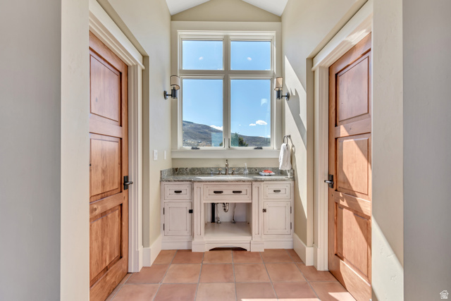 2579 Splendor Valley Road Kamas, UT 84036 - Photo 77 of 87 Bathroom featuring vanity, light tile patterned flooring, a mountain view, and lofted ceiling